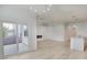 Open-concept living space boasts hardwood floors, fireplace, and sliding doors to the porch at 964 Irving Dr., Little River, SC 29566