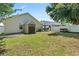 Spacious backyard with storage shed, covered patio, and a white vinyl fence at 1007 Autumn Dr., Murrells Inlet, SC 29576