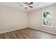 Cozy bedroom features a ceiling fan and a window that fills the room with natural light at 1007 Autumn Dr., Murrells Inlet, SC 29576
