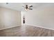 Empty bedroom with ceiling fan and view into the kitchen at 1007 Autumn Dr., Murrells Inlet, SC 29576