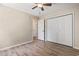 Bedroom boasts wood-look floors, a ceiling fan, and closet space, combining comfort and functionality at 1007 Autumn Dr., Murrells Inlet, SC 29576