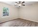 Bright bedroom featuring a ceiling fan and window, creating a comfortable and inviting space at 1007 Autumn Dr., Murrells Inlet, SC 29576