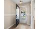Welcoming entryway showcasing wood-look floors and a view of the front porch at 1007 Autumn Dr., Murrells Inlet, SC 29576
