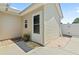 Home exterior with a back door, a gravel and concrete patio, and a charming flower pot at 1007 Autumn Dr., Murrells Inlet, SC 29576