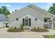 Charming one-story home featuring a landscaped front yard and interesting window design at 1007 Autumn Dr., Murrells Inlet, SC 29576