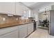 Bright kitchen with stainless steel appliances and a view of the dining area at 1007 Autumn Dr., Murrells Inlet, SC 29576