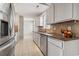 Well-lit kitchen featuring tile flooring and stainless steel refrigerator at 1007 Autumn Dr., Murrells Inlet, SC 29576
