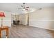 Open living room featuring modern wood flooring, a ceiling fan and neutral walls at 1007 Autumn Dr., Murrells Inlet, SC 29576