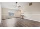 Spacious living room featuring modern wood flooring, large window and neutral walls at 1007 Autumn Dr., Murrells Inlet, SC 29576