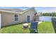 Well-maintained backyard with green grass, patio and fire pit for outdoor enjoyment at 1036 Macala Dr., Conway, SC 29526
