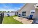 Well-maintained backyard featuring lush green grass, a patio area, and black metal fence at 1036 Macala Dr., Conway, SC 29526