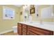 Bathroom featuring a double sink vanity and a bright window for natural light at 1036 Macala Dr., Conway, SC 29526