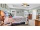 Spacious bedroom with a ceiling fan, two windows, and neutral-colored walls at 1036 Macala Dr., Conway, SC 29526