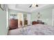 Bedroom leading to bathroom with a ceiling fan, neutral-colored walls and light-colored floors at 1036 Macala Dr., Conway, SC 29526