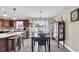 Open-concept dining area featuring a wooden table set and natural light from the windows at 1036 Macala Dr., Conway, SC 29526