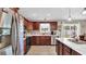 Bright kitchen showcasing stainless steel appliances, wood cabinetry, and a large window at 1036 Macala Dr., Conway, SC 29526
