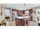 Gourmet kitchen with a center island, modern stainless steel appliances, and wood cabinets at 1036 Macala Dr., Conway, SC 29526