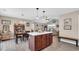 Kitchen island view into the dining and living spaces showcasing open concept layout at 1036 Macala Dr., Conway, SC 29526