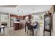 Open-concept kitchen with dark wood cabinets, stainless steel appliances, and a dining area at 1036 Macala Dr., Conway, SC 29526