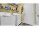 Laundry room features a modern washer and dryer, shelving and door to exterior at 1036 Macala Dr., Conway, SC 29526