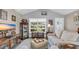 Well-lit living area with a vaulted ceiling, large window view, and comfortable seating at 1036 Macala Dr., Conway, SC 29526