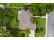 Aerial view of home showcasing a lush backyard, mature trees, and a brown roof at 104 Ashton Circle, Myrtle Beach, SC 29588