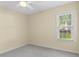 Bedroom with plush carpeting, a window view and neutral wall colors providing a relaxing atmosphere at 104 Ashton Circle, Myrtle Beach, SC 29588