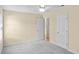 A serene bedroom features soft, neutral walls, a ceiling fan, and plush carpeting at 104 Ashton Circle, Myrtle Beach, SC 29588