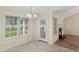 Dining room with a fireplace, a french door, and tile floor with a large window view at 104 Ashton Circle, Myrtle Beach, SC 29588