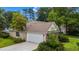 A cozy single-Gathering home boasting an attached two car garage and neatly kept lawn at 104 Ashton Circle, Myrtle Beach, SC 29588