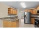 Well-lit kitchen features stainless steel appliances, granite countertops, and ample cabinet space at 104 Ashton Circle, Myrtle Beach, SC 29588