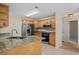 Well-lit kitchen features stainless steel appliances, granite countertops, and ample cabinet space at 104 Ashton Circle, Myrtle Beach, SC 29588