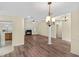 Spacious living room featuring hardwood floors, fireplace, and modern lighting fixtures at 104 Ashton Circle, Myrtle Beach, SC 29588