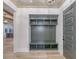 Elegant entryway with custom mudroom storage, stylish light fixture, and wood floors at 1054 East Isle Of Palms Ave., Myrtle Beach, SC 29579
