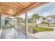 Inviting front porch with concrete floor and wood ceiling at 1054 East Isle Of Palms Ave., Myrtle Beach, SC 29579
