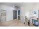 Upstairs hallway with wood railing, view of bathroom, and large chandelier at 1054 East Isle Of Palms Ave., Myrtle Beach, SC 29579