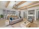 Open-concept living room with exposed beams, modern light fixtures, and seamless flow into a gourmet kitchen at 1054 East Isle Of Palms Ave., Myrtle Beach, SC 29579