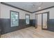Room boasts natural light from two windows, complementing the wood floors and neutral tones at 1054 East Isle Of Palms Ave., Myrtle Beach, SC 29579