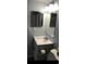 Bathroom featuring modern vanity, mirror, lighting, and toilet at 1101 2Nd Ave. N # 306, Surfside Beach, SC 29575