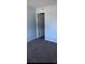 Bright bedroom with light blue walls, plush carpet, and an open door at 1101 2Nd Ave. N # 306, Surfside Beach, SC 29575