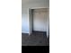 Bedroom closet with a hanging rod and folding doors at 1101 2Nd Ave. N # 306, Surfside Beach, SC 29575