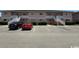 Condo exterior with covered stairs, parking and manicured bushes in front of building at 1101 2Nd Ave. N # 306, Surfside Beach, SC 29575