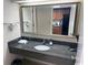 Bathroom with a granite countertop, mirror, and ample space for toiletries at 1105 S Ocean Blvd. # 136, Myrtle Beach, SC 29577