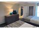 Comfortable bedroom with two beds and a view of the kitchen and closet at 1105 S Ocean Blvd. # 136, Myrtle Beach, SC 29577