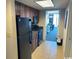 Galley kitchen features wood cabinets and is equipped with essential appliances at 1105 S Ocean Blvd. # 136, Myrtle Beach, SC 29577
