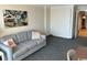 Comfortable living room with a sofa, artwork, and neutral decor at 1105 S Ocean Blvd. # 136, Myrtle Beach, SC 29577