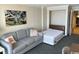 Living room featuring a murphy bed, comfortable sofa, and stylish decor at 1105 S Ocean Blvd. # 136, Myrtle Beach, SC 29577