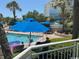 Enjoy the bright outdoor pool with swimmers and shade umbrellas nearby at 1105 S Ocean Blvd. # 136, Myrtle Beach, SC 29577