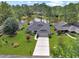 Beautiful aerial view of the home with lush landscaping and a pond at 112 Birchwood Ln., Conway, SC 29526