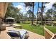 Gorgeous backyard with a deck overlooking a serene pond surrounded by lush greenery at 112 Birchwood Ln., Conway, SC 29526